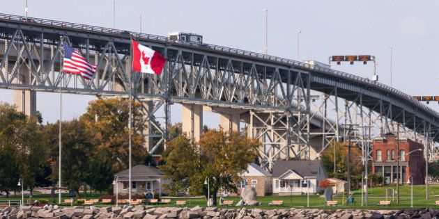 The Bluewater Bridge spanning the St. Clair River connects Sarnia Ontario, Canada, to Port Huron Michigan, USA.