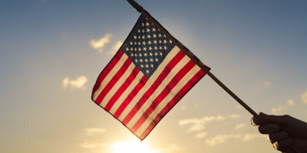 Hand waving american flag.