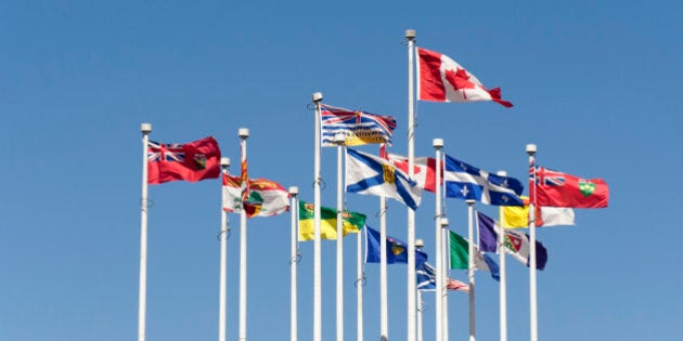 Flags flying in the Wind - Flags of the Canadian Provinces on Canada Place, Vancouver, British Columbia, Canada