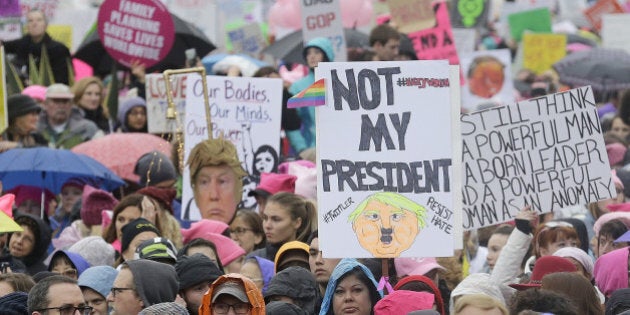 A crowd listens to speakers a rally before a women's march during the first full day of Donald Trump's presidency in San Francisco, Saturday, Jan. 21, 2017. (AP Photo/Jeff Chiu)