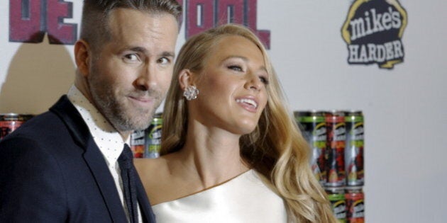 Actor Ryan Reynolds poses with his wife actress Blake Lively at the premiere of