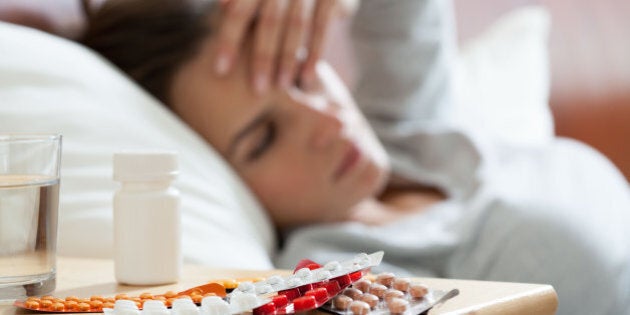 A lot of medicines on night table in bedroom