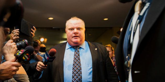 TORONTO, CANADA- NOVEMBER 15: Toronto Mayor Rob Ford is swarmed by media at City Hall after City Council striped him of emergency management powers on November 15, 2013 in Toronto, Canada. (Photo by Aaron Vincent Elkaim/Getty Images)