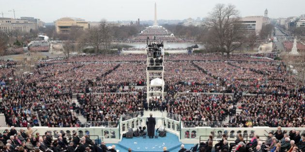WASHINGTON, DC - JANUARY 20: Spectators watch the inauguration proceedings on the West Front of the U.S. Capitol on January 20, 2017 in Washington, DC. In today's inauguration ceremony Donald J. Trump becomes the 45th president of the United States. (Photo by Scott Olson/Getty Images)