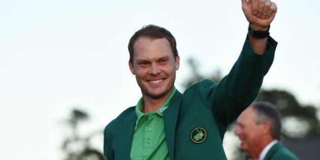 TOPSHOT - England's Danny Willett waves wearing his Green Jacket at the end of the 80th Masters Golf Tournament at the Augusta National Golf Club on April 10, 2016, in Augusta, Georgia.England's Danny Willett won the 80th Masters at Augusta National on Sunday for his first major title. He was trailing defending champion Jordan Spieth by five strokes around the turn, but stormed down the back nine to overhaul the American. Willett is the first Englishman since Nick Faldo 20 years ago to win the Masters and only the second all-time. / AFP / DON EMMERT (Photo credit should read DON EMMERT/AFP/Getty Images)