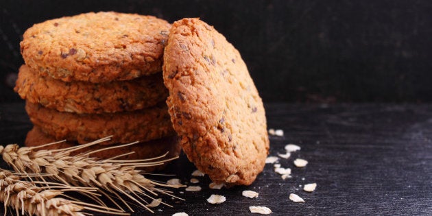 Oatmeal cookies with grains on a black background