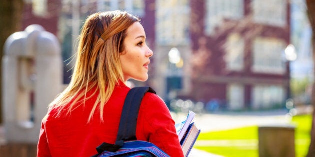 A young female college student between classes.