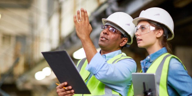 MAle engineer showing the project to his colleague