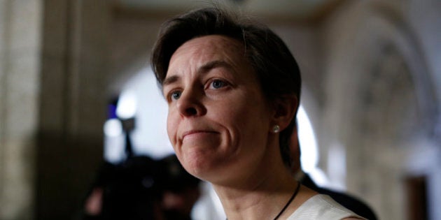 Canada's Labour Minister Kellie Leitch pauses while speaking to journalists on Parliament Hill in Ottawa February 16, 2015. Canadian Pacific Railway and the Teamsters Canada union have agreed to seek mediated arbitration, ending a one-day strike at the country's No. 2 railway, Canada's labour minister said on Monday. REUTERS/Chris Wattie (CANADA - Tags: POLITICS BUSINESS EMPLOYMENT TRANSPORT CIVIL UNREST)