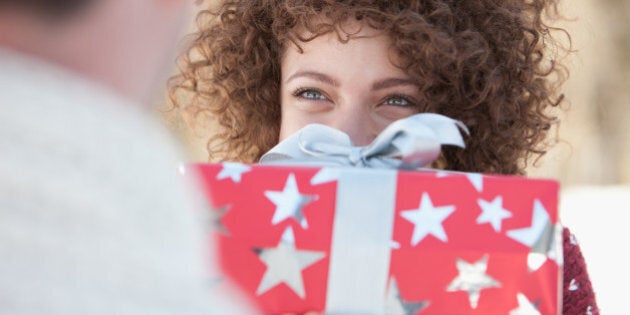 Woman giving man gift