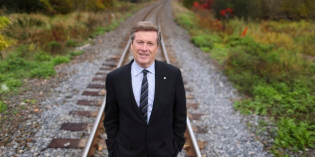 TORONTO, ON - OCTOBER 17: - Mayoral Candidate John Tory is advocating increasing use of existing rail lines in Toronto and the addition of 22 new transit stops in the next 7 years. He calls his transit plan SmartTrack. He is seen near the corner of Bayview and Pottery Road. (Richard Lautens/Toronto Star via Getty Images)