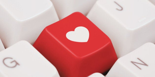 Red computer key with heart shape