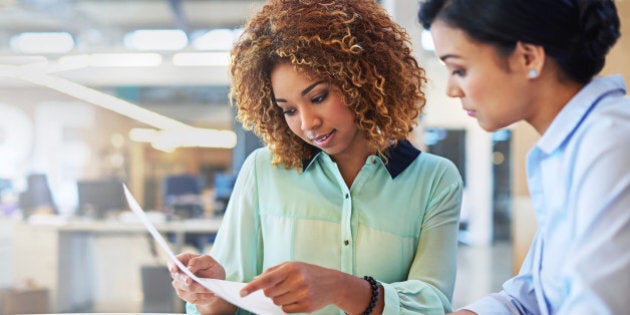 Shot of two businesswoman working together in an office