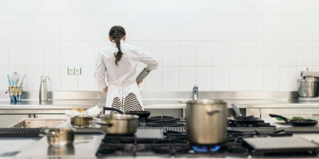 Pretty professional chef cooking in a kitchen.