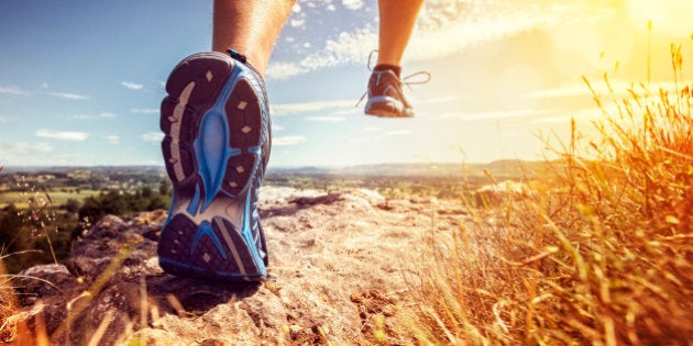 Outdoor cross-country running in summer sunshine concept for exercising, fitness and healthy lifestyle