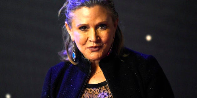 Carrie Fisher poses for cameras as she arrives at the European Premiere of Star Wars, The Force Awakens in Leicester Square, London, December 16, 2015. REUTERS/Paul Hackett