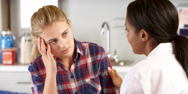 Teenage Girl Visits Doctor's Office Suffering With Depression