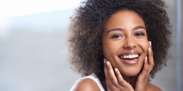 Portrait of an attractive young woman giving you a toothy smile while touching her skinhttp://195.154.178.81/DATA/i_collage/pi/shoots/783545.jpg