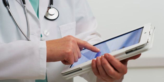 Healthcare professional using digital tablet computer