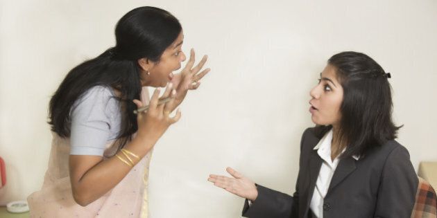 Two Indian Businesswoman fighting and screaming