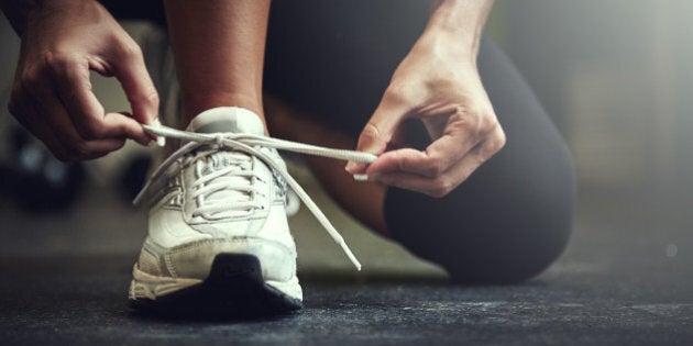 Cropped shot of a young woman tying her shoelaceshttp://195.154.178.81/DATA/i_collage/pu/shoots/806123.jpg