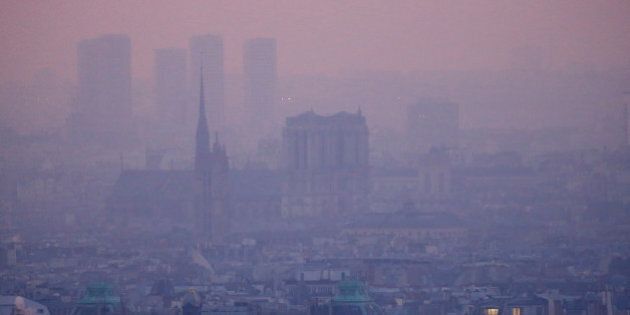 A small-particle haze hangs above the skyline in Paris, France, December 9, 2016 as the City of Light experienced the worst air pollution in a decade. At L, the Notre Dame Cathedral. REUTERS/Gonzalo Fuentes