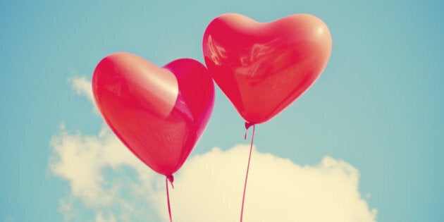 Two red heart-shaped balloons