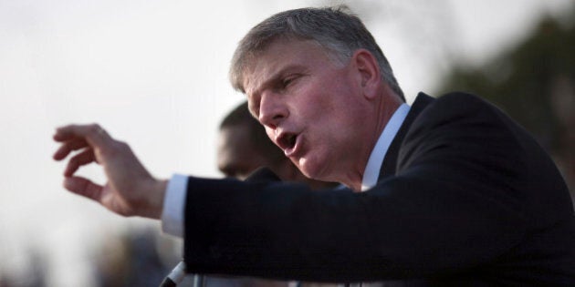 Franklin Graham, son of evangelist Billy Graham, addresses the crowd at the Festival of Hope, an evangelistic rally held at the national stadium in Port-au-Prince, January 9, 2011. REUTERS/Allison Shelley (HAITI - Tags: DISASTER ENVIRONMENT RELIGION)