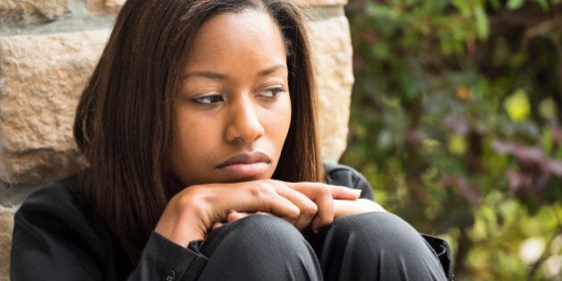 Sad young afro caribbean woman looking at the camera