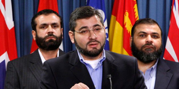 Abdullah Almalki (C), with Muayyed Nureddin (L) and Ahmad El Maati, speaks during a news conference on Parliament Hill in Ottawa October 12, 2007. The men who allege they were tortured in Syria because of information provided by Canadian authorities demanded on Friday that a secret investigation into their case be opened up to the public. REUTERS/Chris Wattie (CANADA)