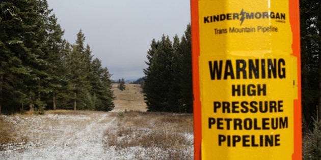 A sign warning of the subterranean presence of Kinder Morgan's Trans Mountain Pipeline in seen in ranchland outside Kamloops, British Columbia, Canada November 16, 2016. REUTERS/Chris Helgren