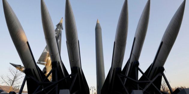 FILE - In this Dec. 26, 2014 file photo, a North Korea's mock Scud-B missile, center, stands among South Korean missiles displayed at Korea War Memorial Museum in Seoul, South Korea. South Korea said Tuesday, Jan. 6, 2015 that rival North Korea has a 6,000-member cyber army dedicated to disrupting the South's military and government. The figure is a dramatic increase from its earlier estimate that the North had a cyberwarfare staff of 3,000. Seoul's Defense Ministry said in a report that North Korea may also have gained the ability to strike the U.S. mainland because of its recent progress in missile technology, which was demonstrated in five long-range missile tests in 2009 and 2012, and is advancing in efforts to miniaturize nuclear warheads to mount on such missiles. (AP Photo/Ahn Young-joon, File)