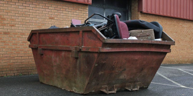 Rusty old skip full of office rubbish or Garbage