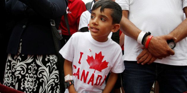 A Syrian refugee waits to shake hands with Canada's Prime Minister Justin Trudeau (not pictured) during Canada Day celebrations on Parliament Hill in Ottawa, Ontario, Canada, July 1, 2016. REUTERS/Chris Wattie