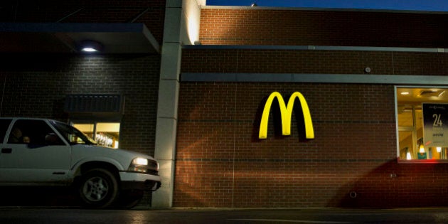 Vehicles move through the drive-thru of a McDonald's Corp. restaurant in Peru, Illinois, U.S., on Monday, July 20, 2015. McDonald's Corp. is scheduled to report quarterly earnings on July 23. Photographer: Daniel Acker/Bloomberg via Getty Images