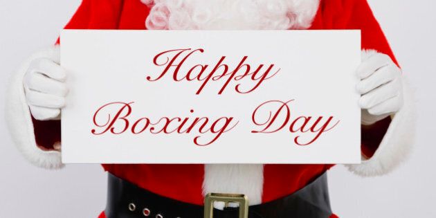 Santa Claus holding Happy Boxing Day sign