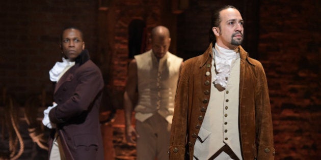 NEW YORK, NY - FEBRUARY 15: Actor Leslie Odom, Jr. (L) and actor, composer Lin-Manuel Miranda (R) perform on stage during 'Hamilton' GRAMMY performance for The 58th GRAMMY Awards at Richard Rodgers Theater on February 15, 2016 in New York City. (Photo by Theo Wargo/WireImage)