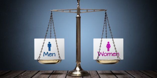 Equality between man and woman concept with beam scales and sign