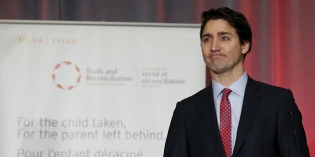 Canada's Prime Minister Justin Trudeau pauses while speaking during the release of the Truth and Reconciliation Commission's final report in Ottawa, Canada, December 15, 2015. Trudeau pledged to work toward full reconciliation with Canadian Aboriginals on Tuesday as he accepted a final report on the abuses of the government's now-defunct system of residential schools for indigenous children. REUTERS/Chris Wattie