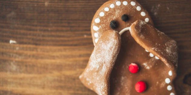 Sad little gingerbread man covering his face