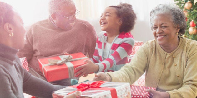 Family opening Christmas presents together