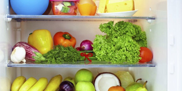 refrigerator full of healthy food. fruits and vegetables