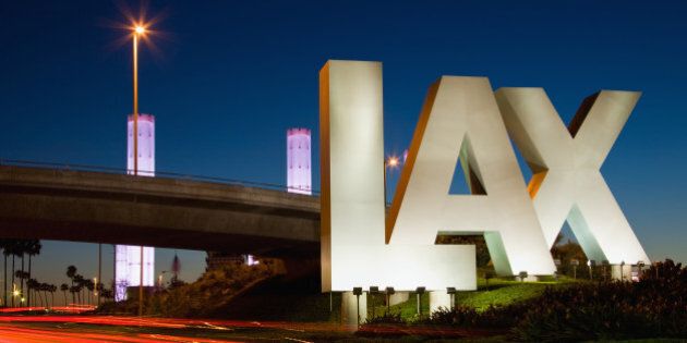 USA, California, Los Angeles, Road to International Los Angeles Airport, illuminated LAX sign