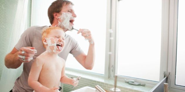 Father and Son Shaving in Bathroom, Portland, Oregon, USA