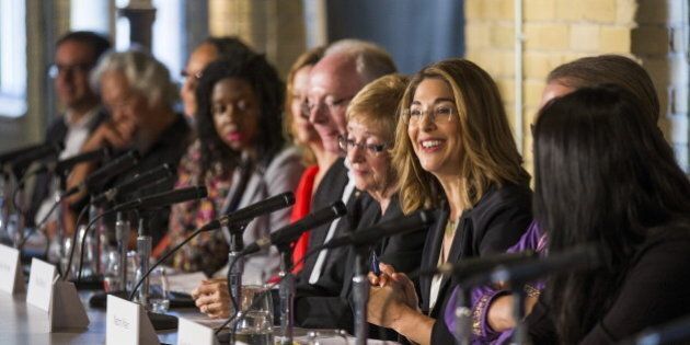 Author Naomi Klein (3rd R) speaks during a news conference to launch the