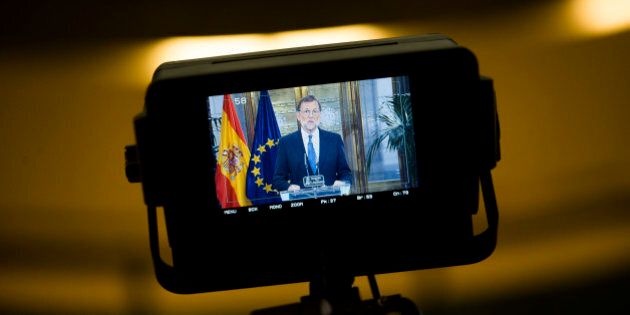 Spain's acting Prime Minister and Popular Party leader Mariano Rajoy is shown in a tv camera screen as he talks to journalists during a news conference following a meeting with Ciudadanos party leader Albert Rivera at the Spanish parliament in Madrid, Sunday, Aug. 28, 2016. Spanish conservative Popular Party has signed a deal with smaller, business-friendly Ciudadanos that could help avoid a possible third round of elections and possibly end the country's eight month political deadlock. (AP Photo/Francisco Seco)