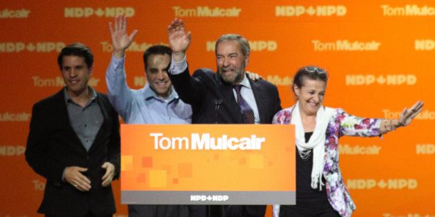 Canada's New Democratic Party (NDP) leader Tom Mulcair waves with his wife Catherine and sons Greg (L) and Matthew after he gave his concession speech after Canada's federal election in Montreal, Quebec, October 19, 2015. REUTERS/Mathieu Belanger