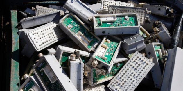 Pile of old electronic components in bin