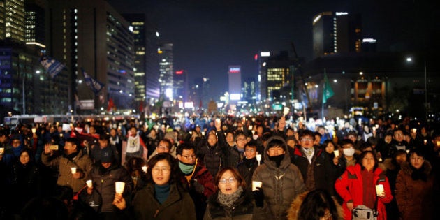 People attend a protest calling for South Korean President Park Geun-hye to step down in central Seoul, South Korea, November 30, 2016. REUTERS/Kim Hong-Ji TPX IMAGES OF THE DAY