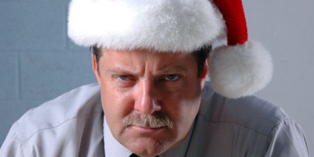 Mid Level manager wearing a santa hat and a bah humbug expression. Click photo below to see other pictures of this model.